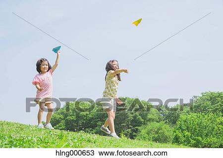 Stock Image - Japanese kids playing in a park. Fotosearch