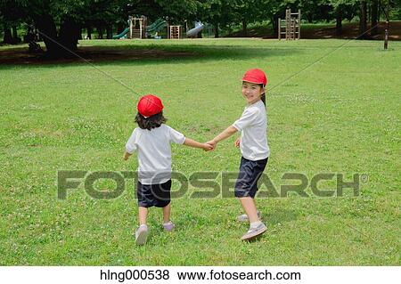 Japanese kids playing in a park View Large Photo Image Stock Photo - Japanese kids playing in a park. Fotosearch