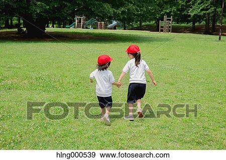 Japanese kids playing in a park View Large Photo Image Stock Photo - Japanese kids playing in a park. Fotosearch