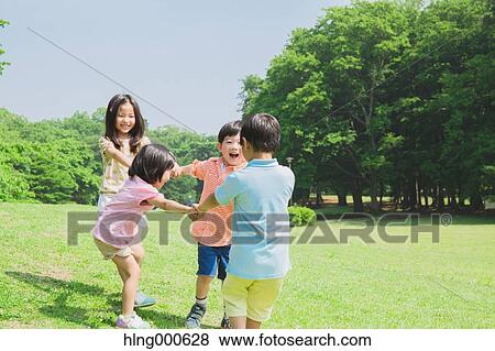 Japanese kids playing in a park View Large Photo Image Stock Photo - Japanese kids playing in a park. Fotosearch