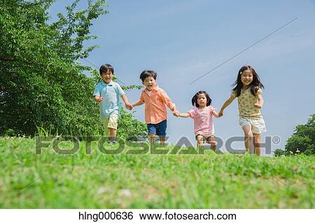 Japanese kids playing in a park View Large Photo Image Stock Photograph - Japanese kids playing in a park. Fotosearch