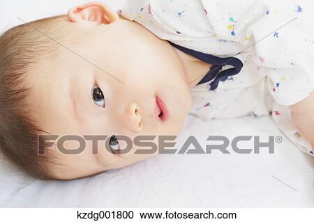 Stock Image - Japanese newborn portrait. Fotosearch