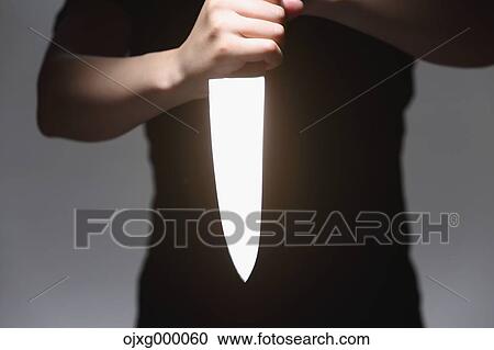 Man holding kitchen knife View Large Photo Image Stock Image - Man holding kitchen knife. Fotosearch