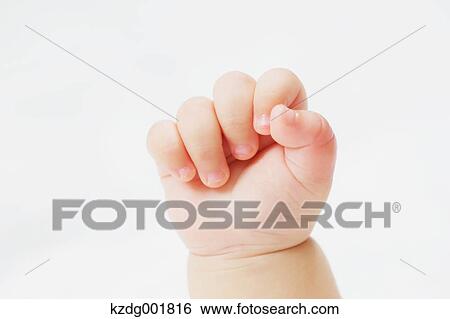 Stock Photograph - Newborn hand. Fotosearch