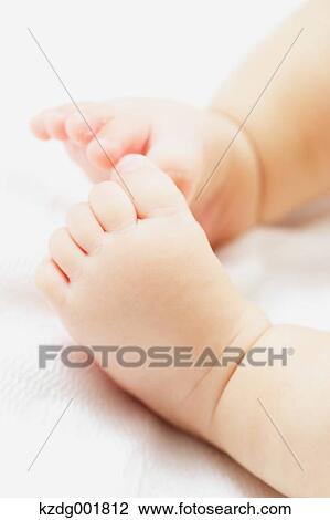 Stock Image - Newborn legs. Fotosearch