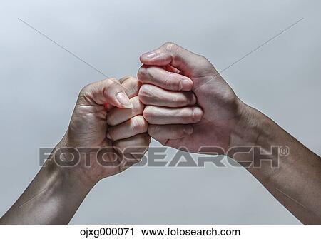 Two fists touching View Large Photo Image Stock Image - Two fists touching. Fotosearch