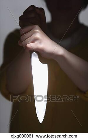 Woman holding kitchen knife View Large Photo Image Stock Image - Woman holding kitchen knife. Fotosearch