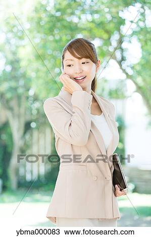 Attractive young girl with smartphone View Large Photo Image Stock Image - Attractive young girl with smartphone. Fotosearch