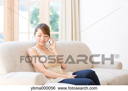 Attractive young girl with smartphone View Large Photo Image Stock Photograph - Attractive young girl with smartphone. Fotosearch