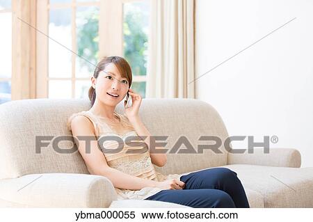 Stock Photography - Attractive young girl with smartphone. Fotosearch