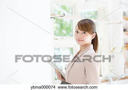 Attractive young girl with tablet View Large Photo Image Picture - Attractive young girl with tablet. Fotosearch