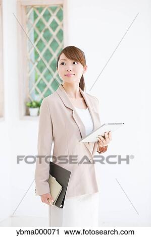 Attractive young girl with tablet View Large Photo Image Stock Image - Attractive young girl with tablet. Fotosearch