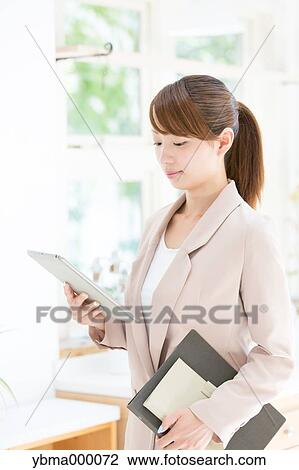 Attractive young girl with tablet View Large Photo Image Stock Image - Attractive young girl with tablet. Fotosearch