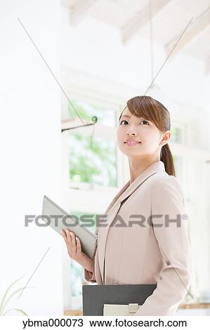 Attractive young girl with tablet View Large Photo Image Stock Image - Attractive young girl with tablet. Fotosearch