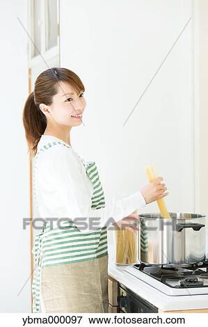 Attractive young housewife View Large Photo Image Stock Photo - Attractive young housewife. Fotosearch