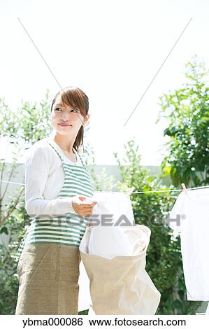 Attractive young housewife View Large Photo Image Stock Photograph - Attractive young housewife. Fotosearch
