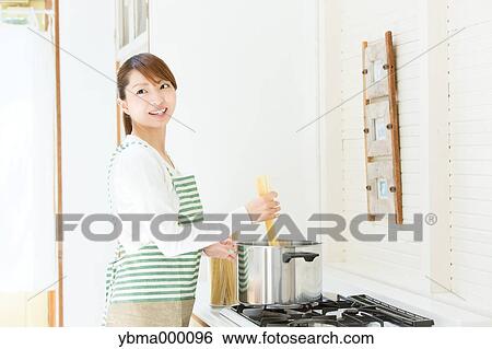 Attractive young housewife View Large Photo Image Stock Photograph - Attractive young housewife. Fotosearch
