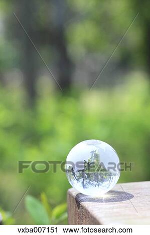 Glass globe in a forest View Large Photo Image Stock Image - Glass globe in a forest. Fotosearch