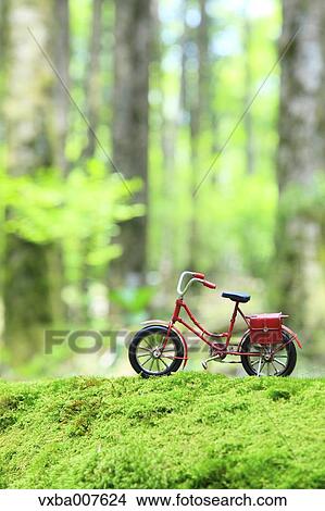 Miniature bicycle in nature View Large Photo Image Picture - Miniature bicycle in nature. Fotosearch