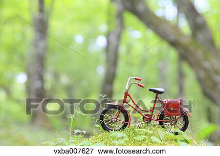 Miniature bicycle in nature View Large Photo Image Stock Photo - Miniature bicycle in nature. Fotosearch