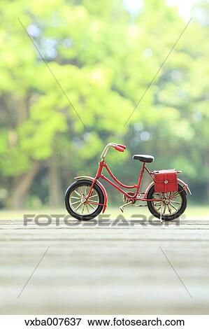 Miniature bicycle in nature View Large Photo Image Stock Photo - Miniature bicycle in nature. Fotosearch