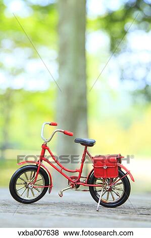 Miniature bicycle in nature View Large Photo Image Stock Photo - Miniature bicycle in nature. Fotosearch