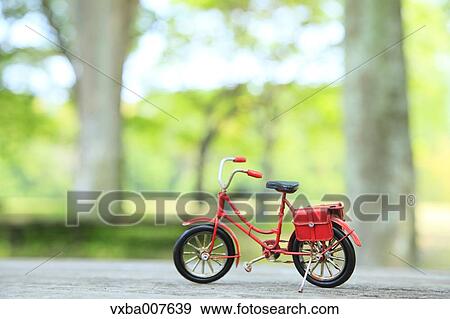 Miniature bicycle in nature View Large Photo Image Stock Photo - Miniature bicycle in nature. Fotosearch