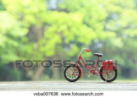 Miniature bicycle in nature View Large Photo Image Stock Photograph - Miniature bicycle in nature. Fotosearch