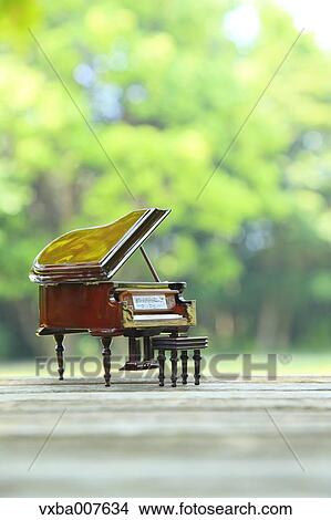 Miniature piano in nature View Large Photo Image Picture - Miniature piano in nature. Fotosearch