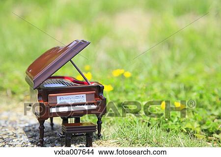Miniature piano in nature View Large Photo Image Picture - Miniature piano in nature. Fotosearch