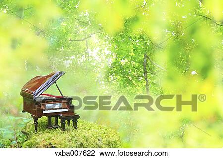 Miniature piano in nature View Large Photo Image Stock Image - Miniature piano in nature. Fotosearch