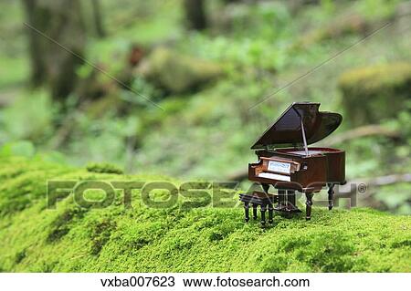 Miniature piano in nature View Large Photo Image Stock Image - Miniature piano in nature. Fotosearch