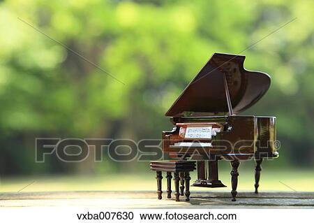 Miniature piano in nature View Large Photo Image Stock Image - Miniature piano in nature. Fotosearch
