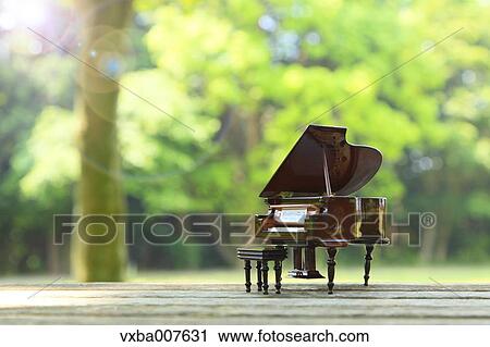 Miniature piano in nature View Large Photo Image Stock Image - Miniature piano in nature. Fotosearch