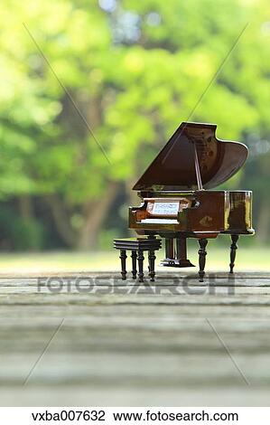 Miniature piano in nature View Large Photo Image Stock Image - Miniature piano in nature. Fotosearch