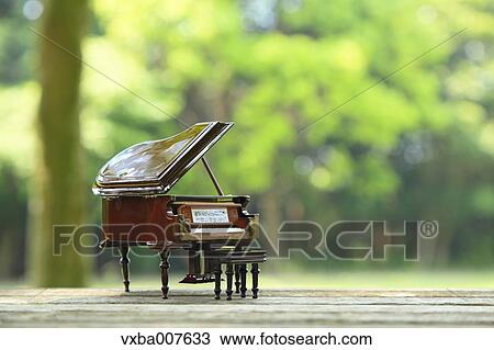 Miniature piano in nature View Large Photo Image Stock Image - Miniature piano in nature. Fotosearch