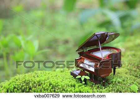 Miniature piano in nature View Large Photo Image Stock Photo - Miniature piano in nature. Fotosearch