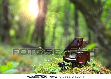 Miniature piano in nature View Large Photo Image Stock Photograph - Miniature piano in nature. Fotosearch