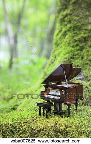 Miniature piano in nature View Large Photo Image Stock Photography - Miniature piano in nature. Fotosearch