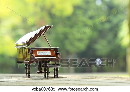 Miniature piano in nature View Large Photo Image Stock Photography - Miniature piano in nature. Fotosearch
