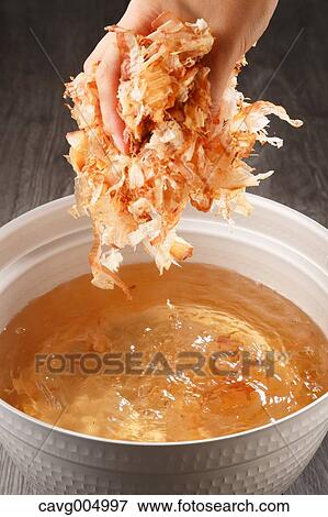 Young Japanese girl adding Katsuobushi to soup View Large Photo Image Stock Photo - Young Japanese girl adding Katsuobushi to soup. Fotosearch