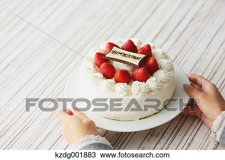 Young Japanese girl holding strawberry cake View Large Photo Image Stock Image - Young Japanese girl holding strawberry cake. Fotosearch