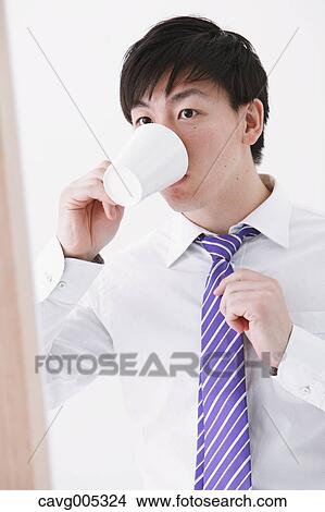 Businessman drinking coffee View Large Photo Image Picture - Businessman drinking coffee. Fotosearch