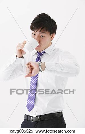 Businessman drinking coffee View Large Photo Image Stock Photography - Businessman drinking coffee. Fotosearch