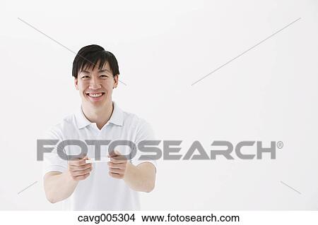 Picture - Businessman giving business card. Fotosearch