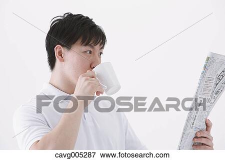 Businessman with newspaper and coffee View Large Photo Image Stock Photo - Businessman with newspaper and coffee. Fotosearch