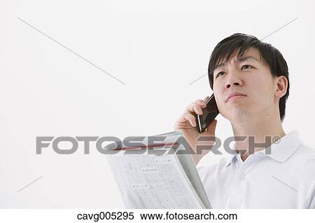Businessman with newspaper and phone View Large Photo Image Stock Photography - Businessman with newspaper and phone. Fotosearch