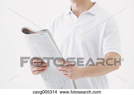 Businessman with newspaper View Large Photo Image Picture - Businessman with newspaper. Fotosearch