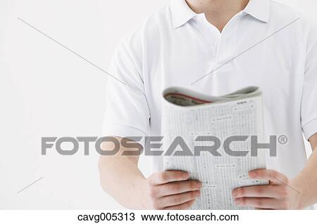 Businessman with newspaper View Large Photo Image Stock Image - Businessman with newspaper. Fotosearch