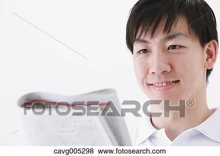 Businessman with newspaper View Large Photo Image Stock Photo - Businessman with newspaper. Fotosearch